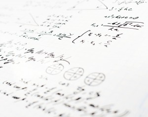 Squared sheet of paper filled with trigonometry math equations and formulas as a background composition with the shallow depth of field